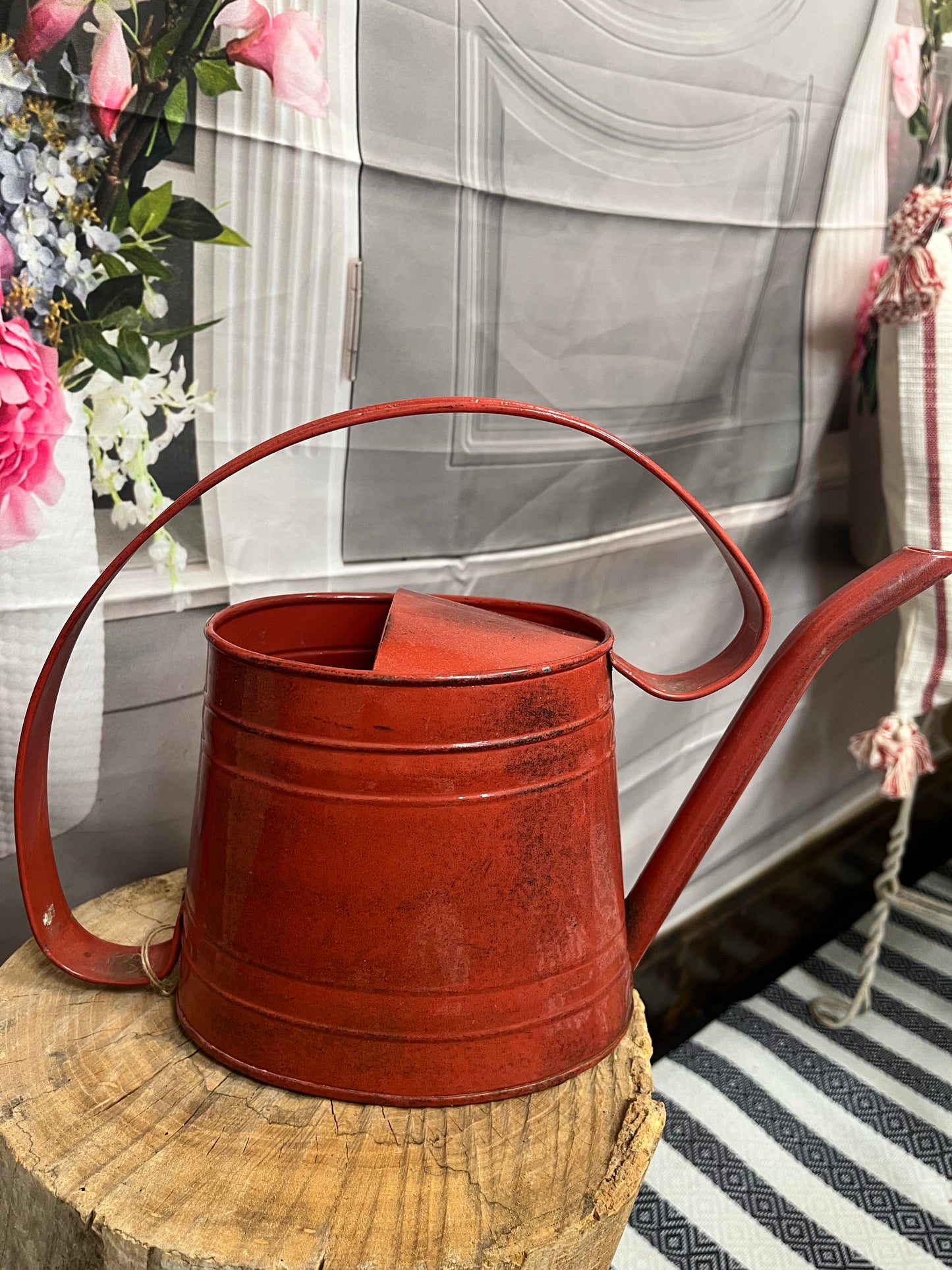 Small red water can