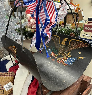 Vintage cast iron fire log holder with American Eagle design